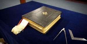 Masonic Bible square and compasses on altar
