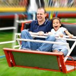 Father and Daughter at Amusement Park Ride