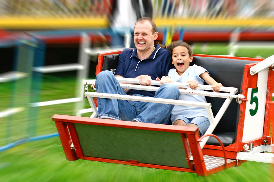 Father and Daughter at Amusement Park Ride